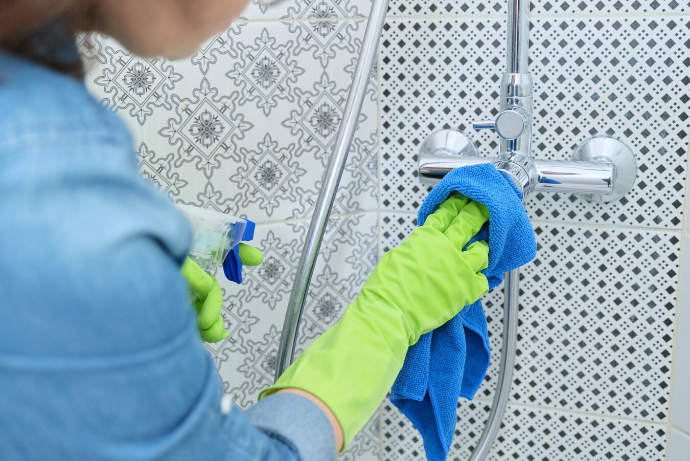 House Cleaner Cleaning the Bathroom Hardwares 