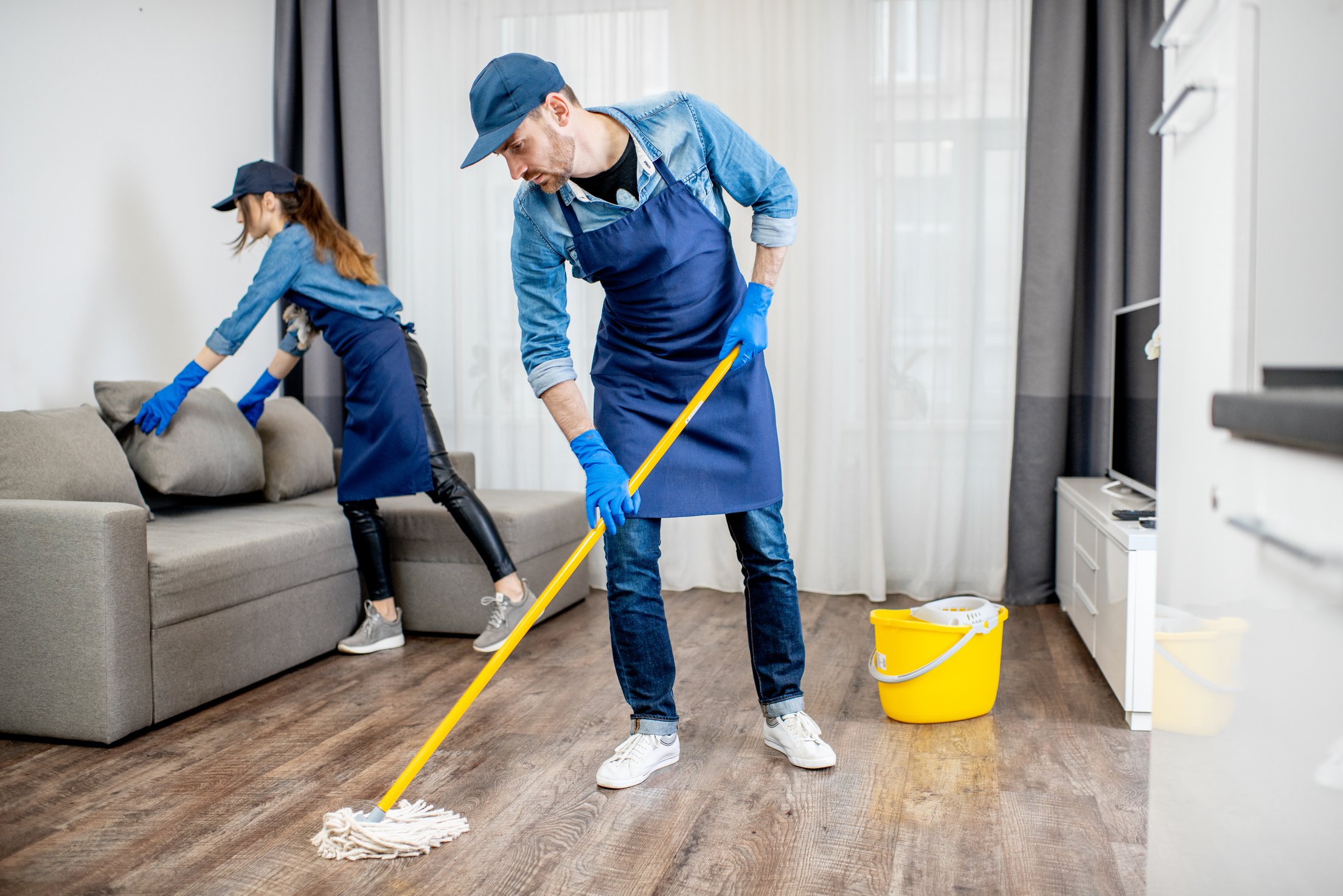 Housekeepers Cleaning the Apartment